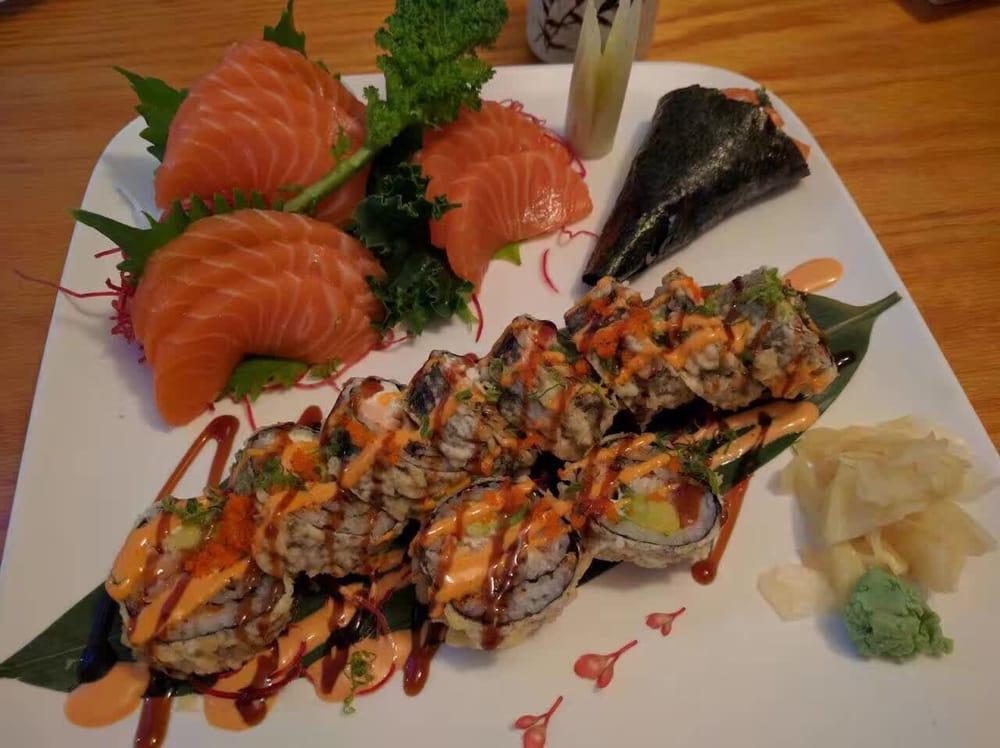 Manhattan Roll · Deep fried roll of smoked salmon with cheese and avocado, eel, and kani, with sauce on top. 10 pieces.