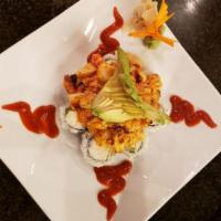 Volcano Roll · Oven-baked California roll topped with spicy mayo and scallops, crawfish or combo (scallops ...