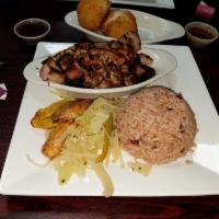 Jam Jerk Pork · Marinated pork shoulder done with house jerk sauce and smoked on hickory wood grill. Served ...