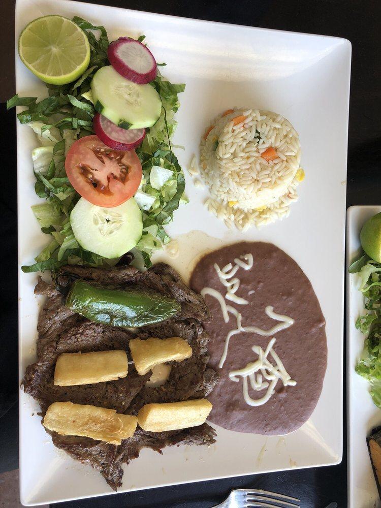 Carne Asada · Asada served with fried cassava roots, rice and beans.
