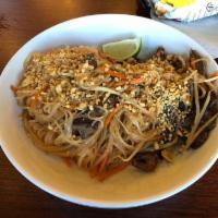 Beef Pad Thai Noodles · Wok tossed rice noodles in a sweet and tangy tamarind sauce with bean sprouts, carrots and o...