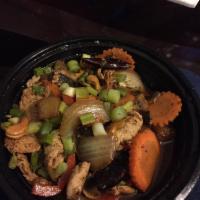 Cashew Chicken · Stir fried chicken breast with sweet peppers, mushrooms, onions, and pineapples topped with ...