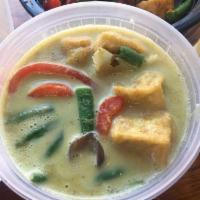 Green Curry · Thai green curry with eggplant, basil leaves, bamboo shoots and sweet and hot peppers and si...