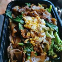 Pad See Ewe · Stir-fried wide rice noodles with egg, Chinese broccoli, meat in a light soy sauce.