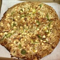Thai Peanut Curry Pizza · Chicken or paneer with mozzarella, bell peppers, carrots, cilantro and peanuts on peanut cur...