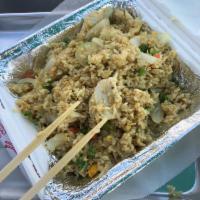 Curry Fried Rice · Stir-fried with curry powder, eggs, onions, green onions, peas and carrots. Can be made vegan.