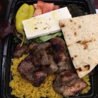 Chicken Souvlaki Platter · Served with your choice of rice or french fries, salad, pita and tzatziki sauce.