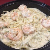 Shrimp Alfredo Over Pasta Dinner · Served with side salad with garlic bread.