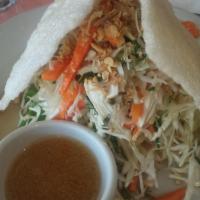 Chicken and Cabbage Salad · Shredded chicken, cabbage, pickled carrots, fried onions and Vietnamese herbs. Served with g...