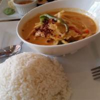 Red Curry · Prepared with bamboo shoots, bell peppers and fresh basil leaves with red curry paste and co...