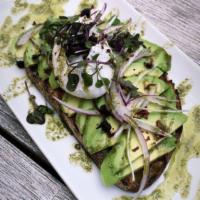 Avocado Toast · Wheat toast, sliced avocado, red onion, feta, poached egg, crushed pepper, and basil sauce.