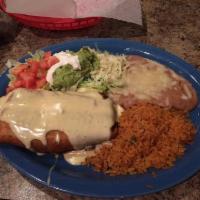 Chimichanga · One flour tortilla, deep-fried and filled with beef or chicken. Topped with cheese and sour ...