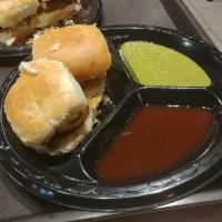 Vada Pav · Tossed buns with spicy potato patties with mint, tamarind and garlic chutney.