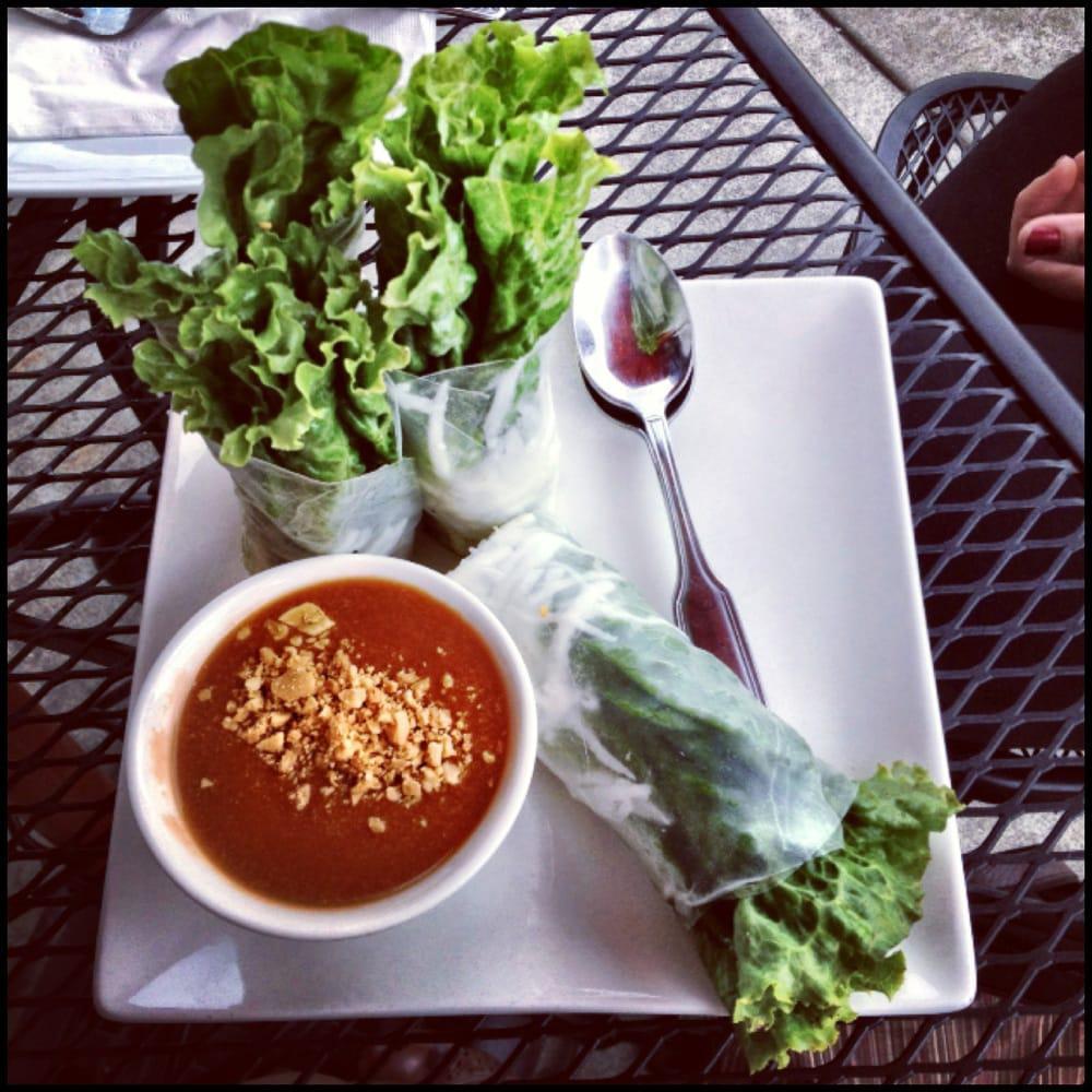Coconut Summer Rolls · Shredded coconut, toasted peanuts, lettuce, sauteed tofu, stir-fried carrots, jicama, basil, crispy rice paper roll wrapped in rice paper, served with a side of homemade peanut sauce.
