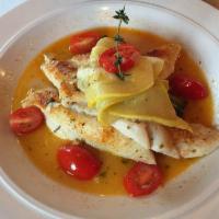 Filet of Sole · Topped with cherry tomatoes, yellow squash, over sautéed spinach in a lemon white wine sauce.