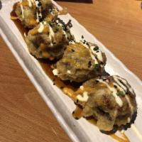 Bella Tempura · Cremini mushrooms stuffed with cream cheese crab salad topped with sauces, seeds and scallio...