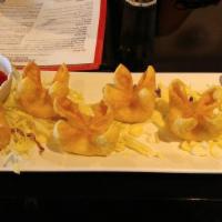 Crab Cheese Wonton · Crab mix, pepper and scallions served with sweet-sour sauce.
