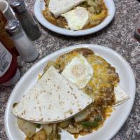 Huevos Rancheros · Flour tortillas topped with chili verde, melted cheese, and two eggs any style.