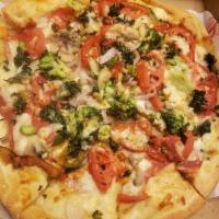 The Veggie Pizza · Onions, green peppers, broccoli, mushrooms, spinach, tomatoes and garlic.