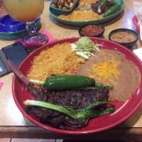 Carne Asada · 9 oz. of thinly sliced, seasoned skirt steak, carefully charbroiled to perfection. Garnished...