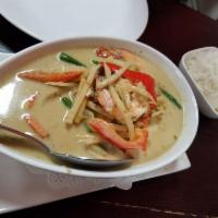 Green Curry · Green curry with coconut milk, green beans, bell peppers, bamboo shoots, carrots, and basil ...