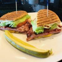 Slim Jane Panini · Grilled ham, Swiss and American cheese, lettuce, tomato, with house made tartar on a sesame ...