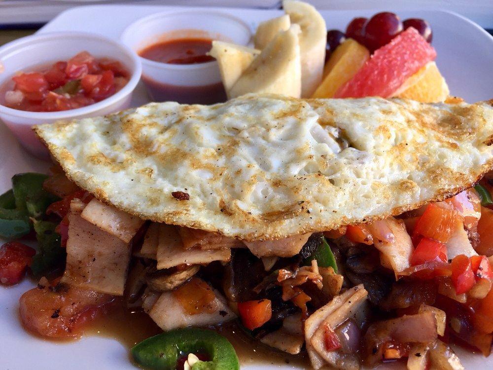 Omelette · A build-your-own omelette. Made fresh and comes with a side of fruits. (Banana, strawberry, grapes, and orange). Comes with 2 eggs, choice of meat, choice of veggies and cheddar cheese.