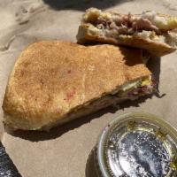 Cuban Sandwich · Comes with roast pork, ham, Swiss cheese, house pickles, and mustard.