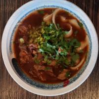 Shanxi Shaved Noodle Soup · Beef brisket, cilantro, pickled mustard and scallion.