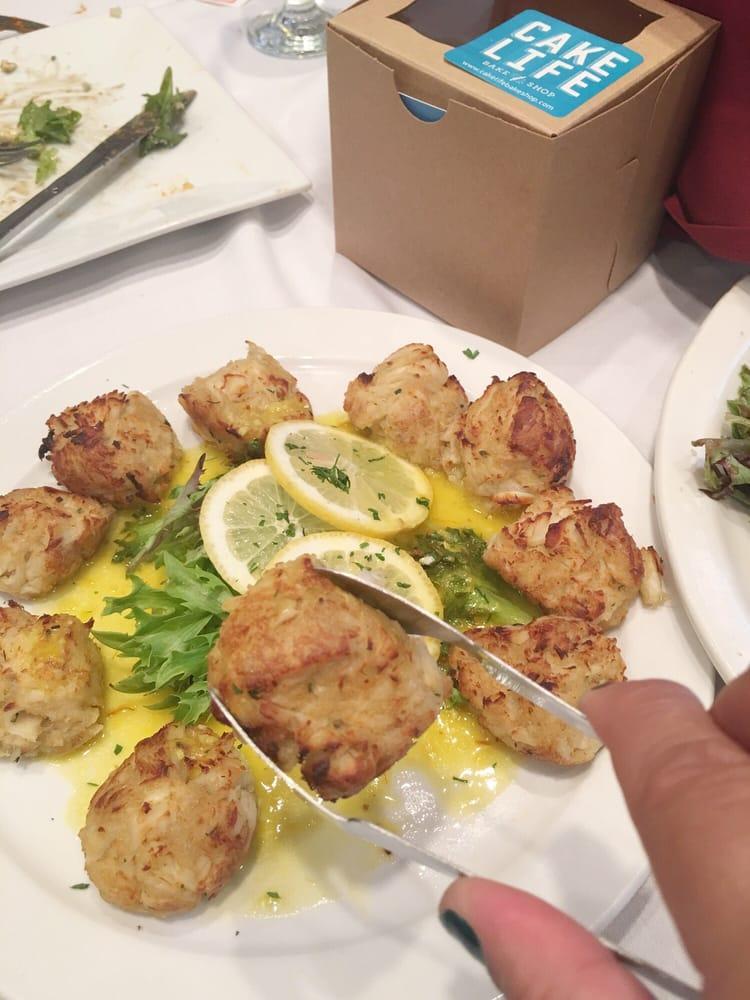 Mini Crab Cakes · Our homemade jumbo lump crab cakes served with a lemon saffron sauce.