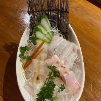Sashimi · On rice or spring mix choose one: salmon, tuna and albacore.