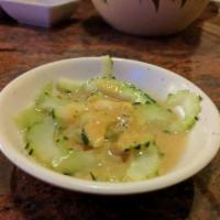 Cucumber Salad · Thinly sliced cucumbers in a mixture of vinegar and pepper.