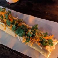 Chicken Banh Mi · French Vietnamese Baguette topped with freshly sliced chicken, pickled vegetables, pate, cil...