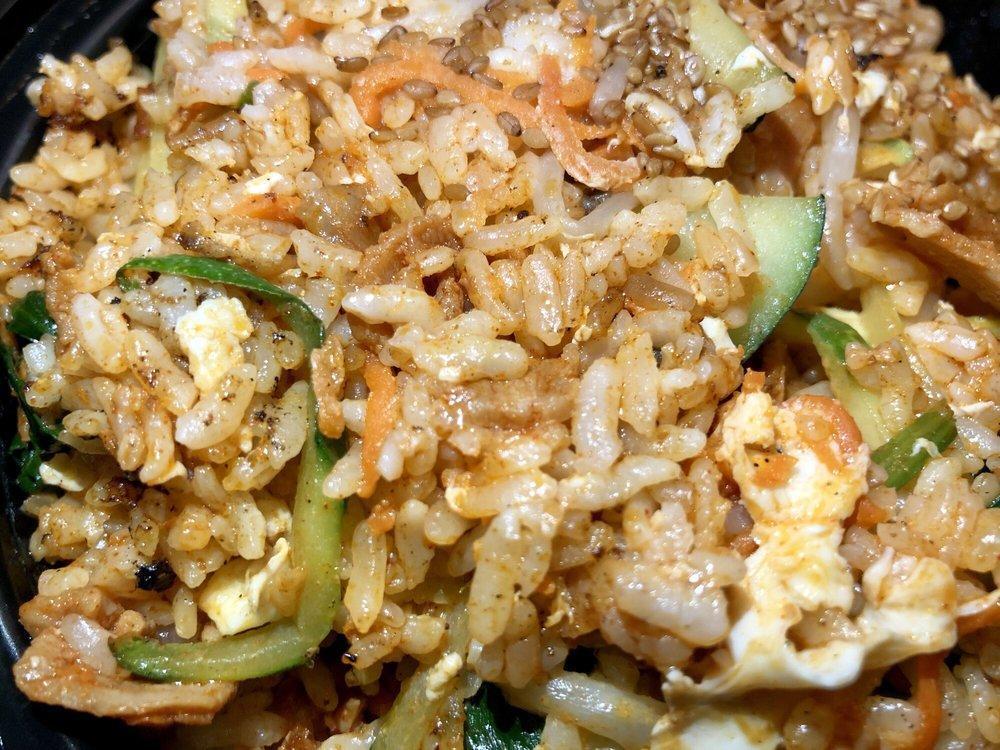 Bulgogi · Thinly sliced rib eye marinated with sweet house sauce, onion, scallion, mushroom, carrot and sesame seeds over sticky rice or brown rice.