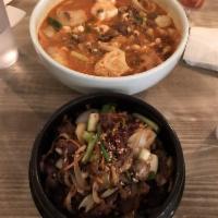 Seafood Spicy Tofu Soup · Spicy stew, silken tofu, shrimp, mussel, squid, onion, scallion and a cracked egg in a hot c...