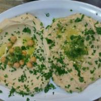 Baba Ghanoush · Baked eggplant and tahini sauce, mixed with minced parsley, garlic, lemon juice and special ...