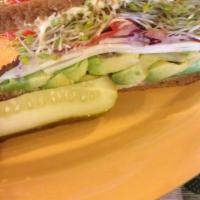 Del Monte Special Sandwich · Hearty 9-grain bread with avocado, Monterey Jack cheese, onions, tomato, clover sprouts, and...