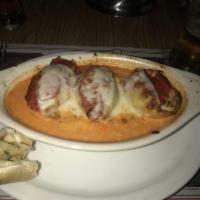 Baked Stuffed Shells · Jumbo pasta shells stuffed with cheese and seasoned beef, then covered with tomato sauce and...