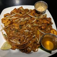 Pad Thai Noodle · Rice noodles, eggs, green onions and bean sprouts served with a lime wedge and crushed peanu...