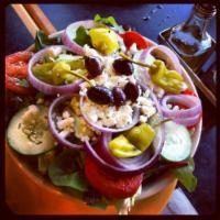 My Big Fat Greek Salad · We combine crisp cucumber, sliced tomatoes, pepperoncini, Kalamata olives, red onion, and Fe...