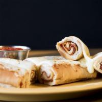 Rho Rho Rolls · Two (2), foot long pepperoni pizza rolls, topped with melted cheese, served with a side of m...