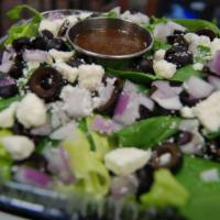 Greek Salad · Romaine lettuce, spinach, black olives, feta, red onions.