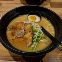Miso Ramen · Mixed with miso broth, egg ramen noodle, 1/2 soy flavored egg, roasted pork, scallions and b...