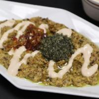 Kashke Bademjan · Roasted eggplant mixed with sauteed onion, garlic, and mint. Served warm and topped with Per...