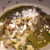 Main Street Special · Cilantro infused potato enchiladas in a bed of poblano cream sauce and topped with brisket, ...
