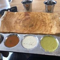 Masala Dosa · Thin rice and lentil crepe filled with mildly spiced mashed potatoes and onions.