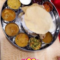 South Indian Thali · Rice, chappathi (1), sambar, rasam, kurma, kootu, poriyal, special kuzhambu, curd, special r...