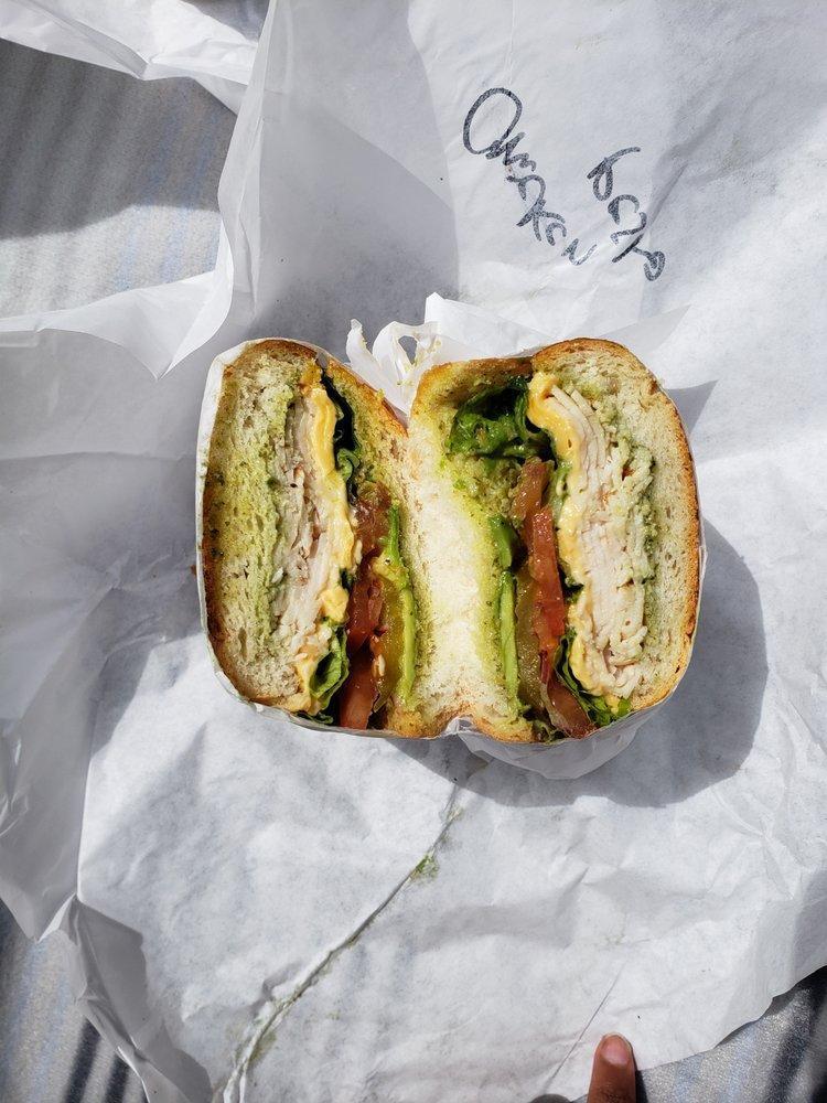 Chicken Pesto Sandwich · Chicken breast, avocado, American cheese, pesto aioli spread on soft and sweet roll. Includes lettuce, tomatoes, red onions, pickles and jalapeno spread.
