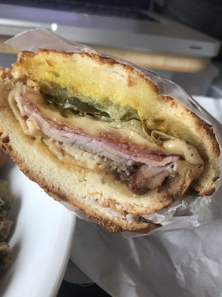 Ultimate Club · Roast beef, turkey, salami, ham, bacon, Swiss cheese, Lou's special sauce, Dijon mustard on a soft and sweet roll. Includes lettuce, tomatoes, red onions, pickles and jalapeno spread.