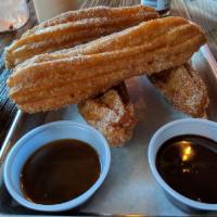 Churros · House-Made Fried Churros Rolled in Cinnamon Sugar served with Chocolate Mole and Caramel Dip...
